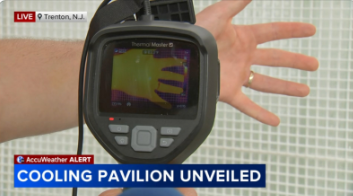AccuWeather live coverage: Cooling Pavilion Unveiled, Trenton NJ — thermal camera showing a hand